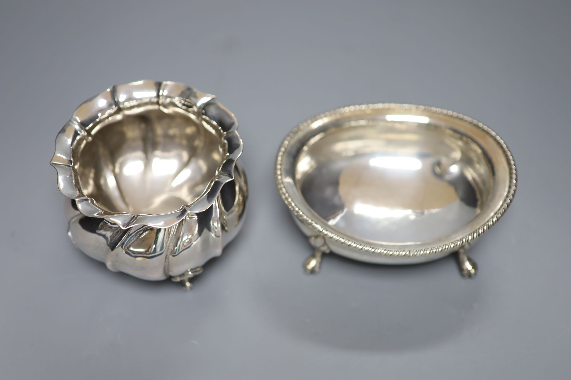 An Italian 800 standard silver oval sugar bowl and a similar circular fluted lobed bowl, 14.4oz